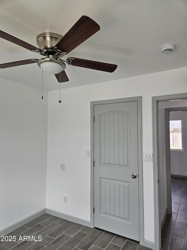 unfurnished room with ceiling fan