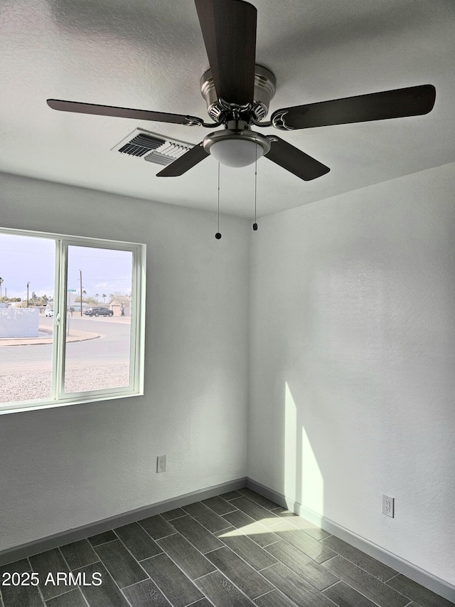 spare room featuring ceiling fan