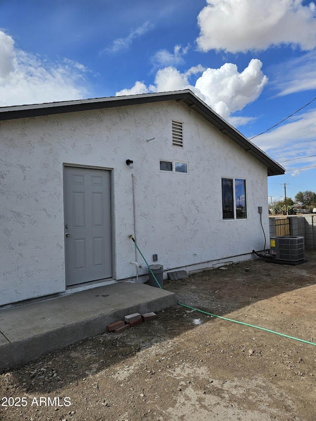 view of property exterior featuring central AC