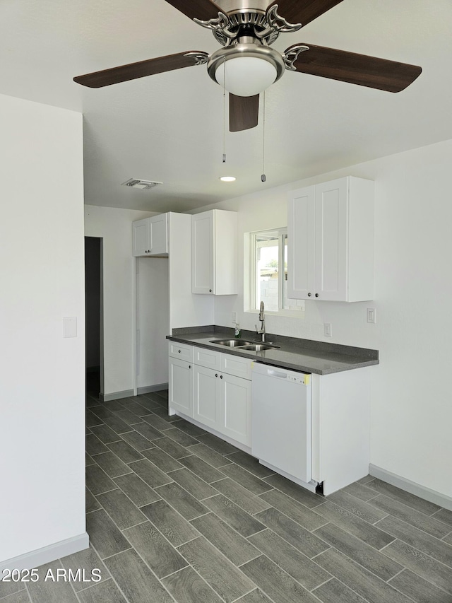 kitchen featuring white cabinetry, sink, ceiling fan, and white dishwasher