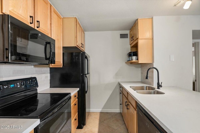 kitchen with tasteful backsplash, sink, black appliances, and light brown cabinets