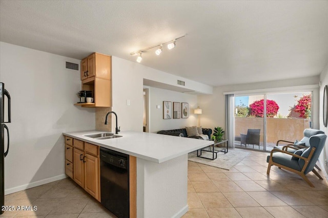 kitchen featuring light tile patterned flooring, sink, a textured ceiling, kitchen peninsula, and black appliances