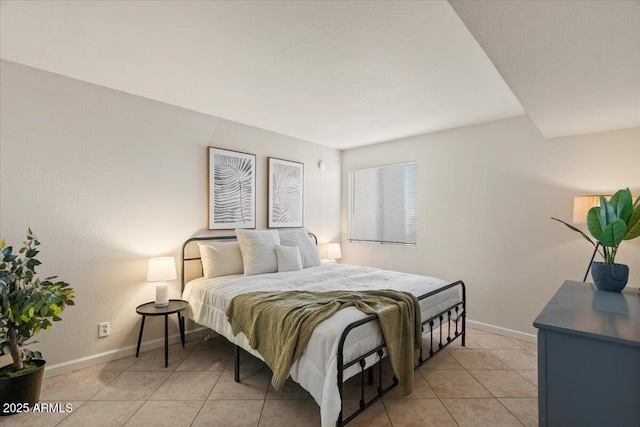 bedroom with light tile patterned floors