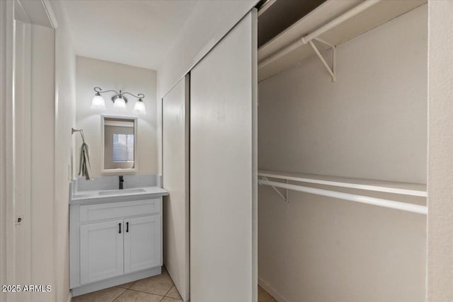 bathroom with vanity and tile patterned flooring