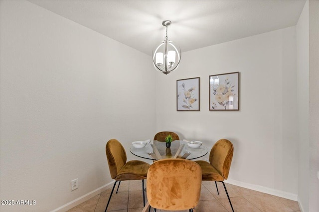 dining area featuring an inviting chandelier and light tile patterned flooring