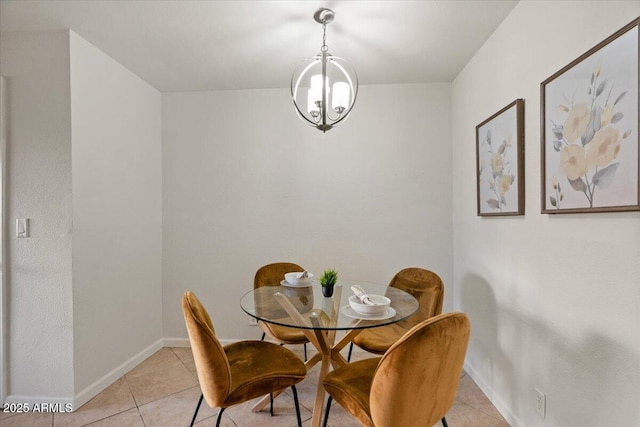 tiled dining room featuring a chandelier