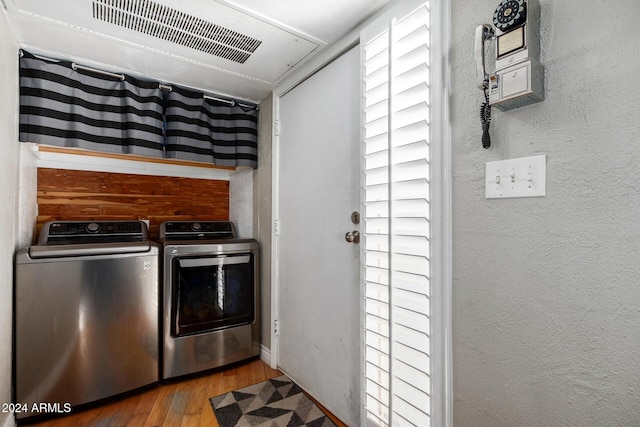 laundry room featuring hardwood / wood-style floors and independent washer and dryer