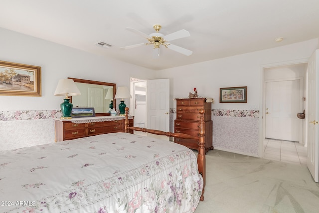 bedroom with light carpet and ceiling fan