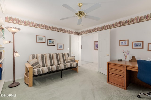 office space with ceiling fan and light carpet