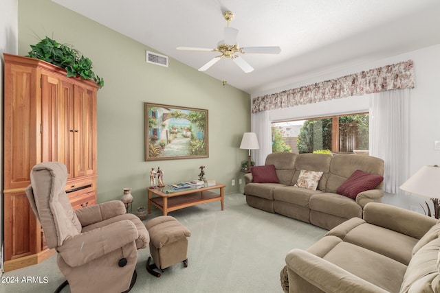 living room featuring light colored carpet, vaulted ceiling, and ceiling fan