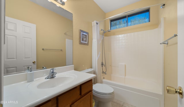 full bathroom featuring toilet, vanity, tile patterned flooring, and shower / washtub combination