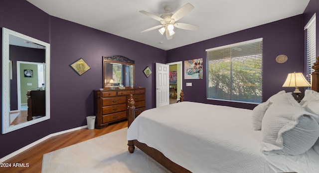 bedroom featuring hardwood / wood-style floors and ceiling fan