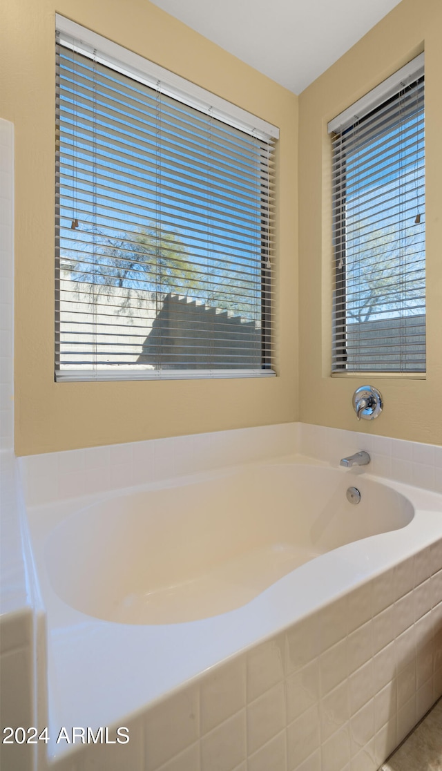 bathroom featuring tiled bath