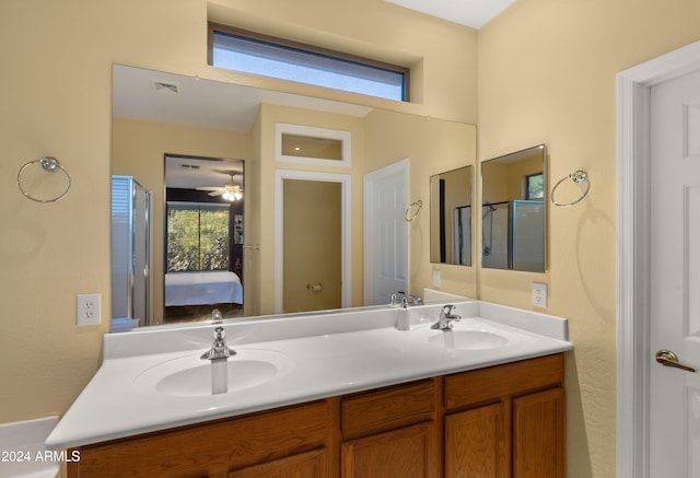 bathroom with an enclosed shower and vanity