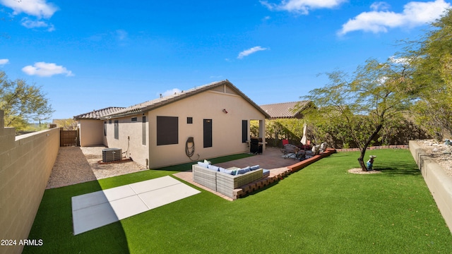 back of house with a patio, a lawn, and cooling unit