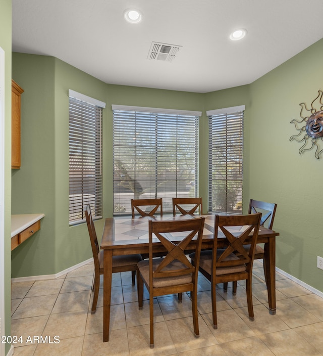 dining area with light tile patterned flooring