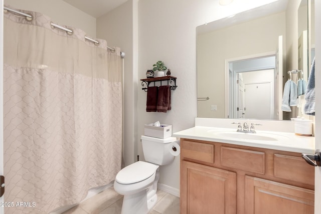 bathroom featuring tile patterned floors, a shower with shower curtain, toilet, and vanity