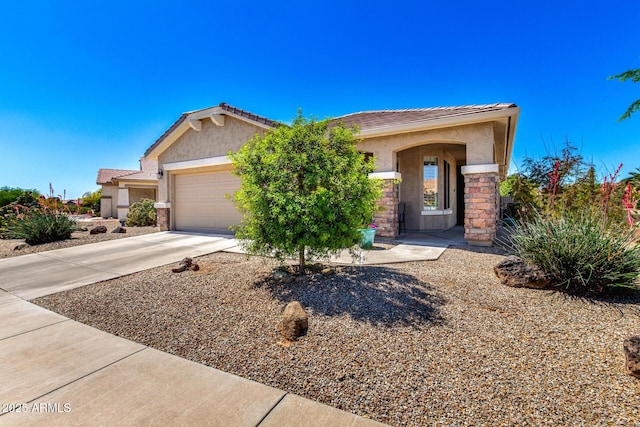 single story home with an attached garage, driveway, stucco siding, and a tiled roof