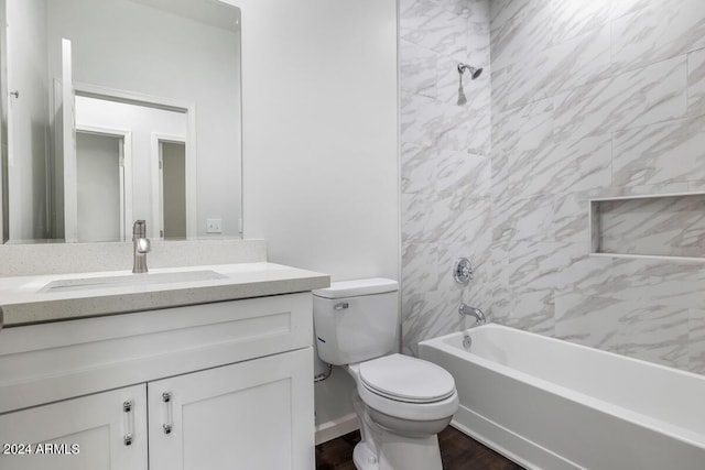 full bathroom with hardwood / wood-style flooring, vanity, toilet, and tiled shower / bath combo