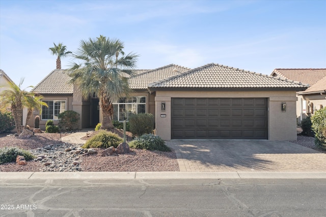 view of front of home with a garage