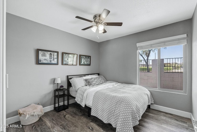 4502 W Continental Dr, Glendale, AZ 85308 - bedroom with dark wood-type flooring, baseboards, and ceiling fan