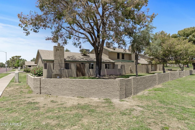 4502 W Continental Dr, Glendale, AZ 85308 - rear view of property featuring a chimney