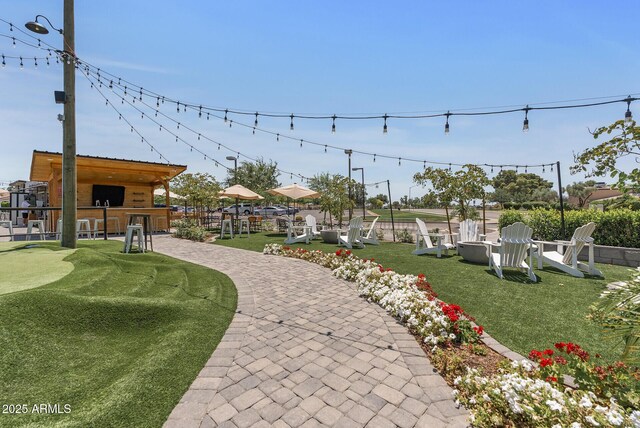 4502 W Continental Dr, Glendale, AZ 85308 - view of home's community featuring an outdoor fire pit and a patio
