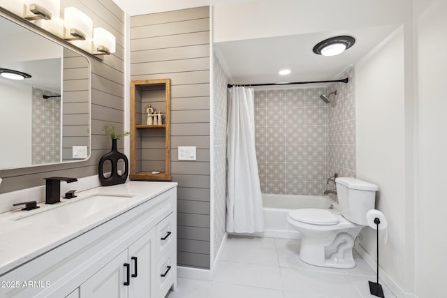 full bathroom featuring tile patterned flooring, shower / tub combo with curtain, toilet, and vanity