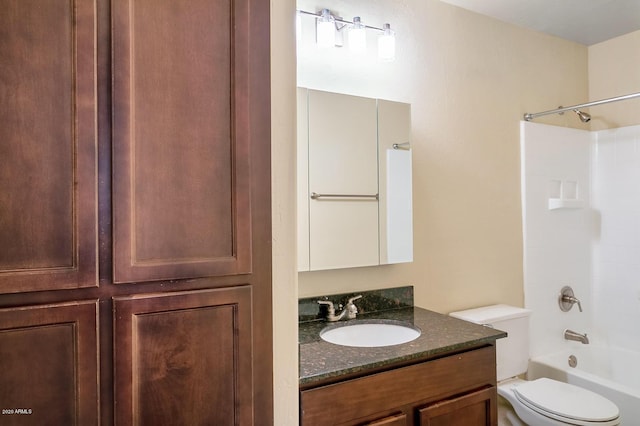 full bathroom with toilet, vanity, and  shower combination