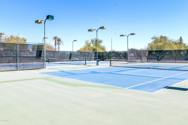 view of tennis court featuring basketball court