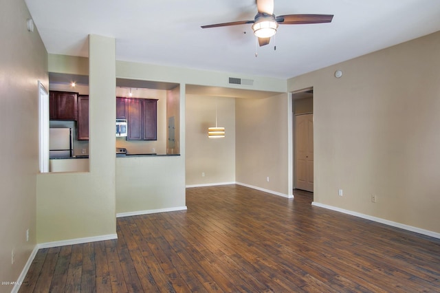 unfurnished living room with ceiling fan and dark hardwood / wood-style floors