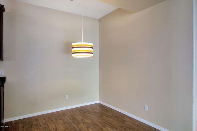 unfurnished dining area with dark hardwood / wood-style floors