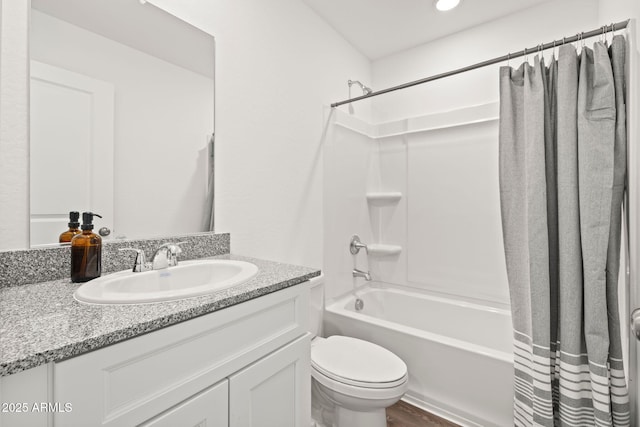 full bathroom featuring toilet, vanity, and shower / bath combo