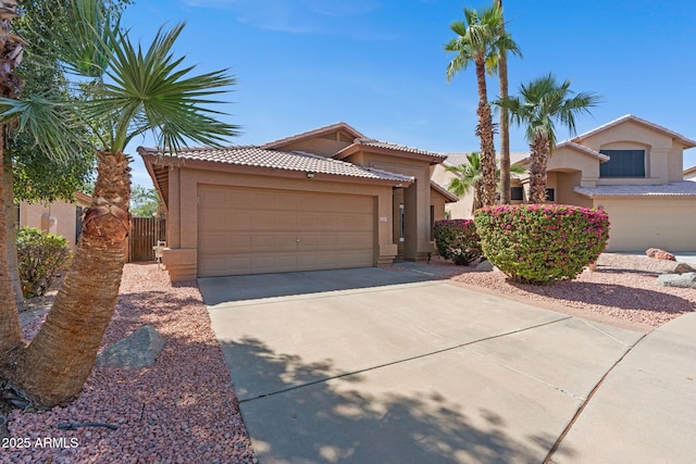 17424 N 1st Ave, Phoenix, AZ 85023 - view of front of home featuring stucco siding, a tile roof, concrete driveway, and a garage