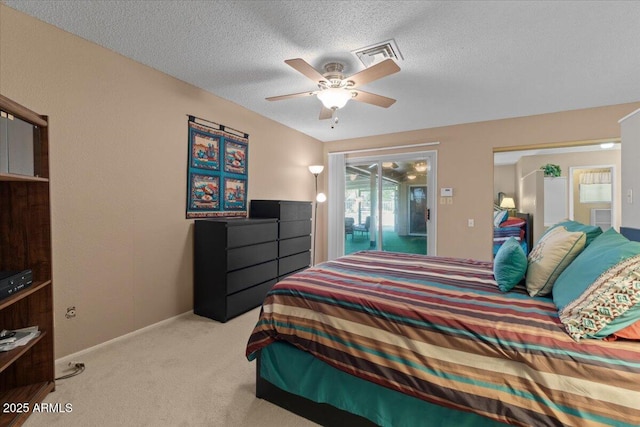 bedroom featuring visible vents, baseboards, ceiling fan, a textured ceiling, and carpet floors