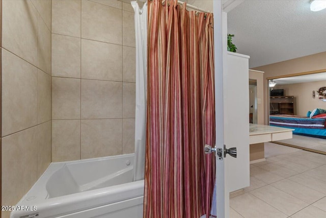 full bath with tile patterned floors, shower / bathtub combination with curtain, and a textured ceiling
