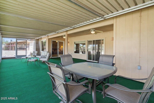 view of patio featuring ceiling fan and outdoor dining area