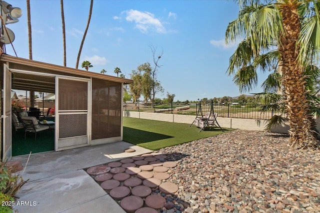 view of yard featuring a patio area and fence