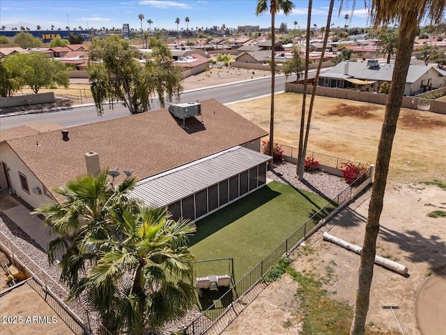 birds eye view of property with a residential view