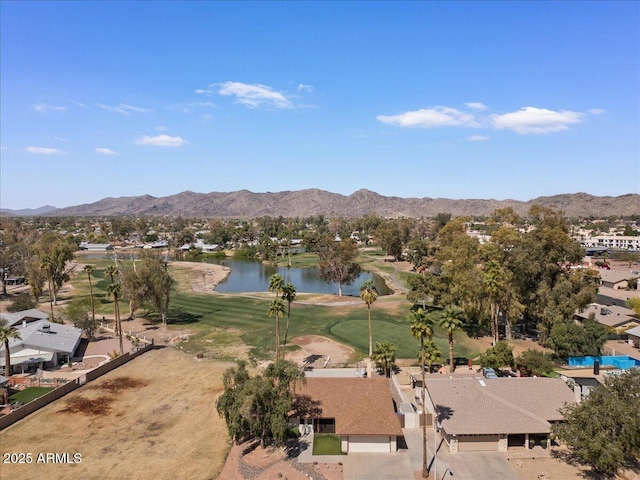 drone / aerial view with a water and mountain view