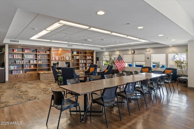 dining room with wood finished floors, visible vents, and recessed lighting