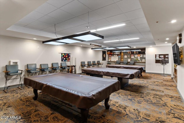 recreation room featuring a paneled ceiling, baseboards, and billiards
