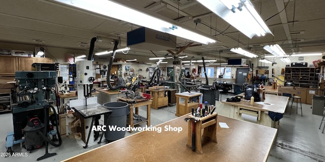 misc room featuring concrete floors and a workshop area