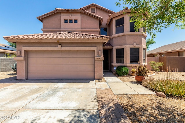16527 N 71st Dr, Peoria, AZ 85382 - mediterranean / spanish home with fence, stucco siding, driveway, and a tile roof