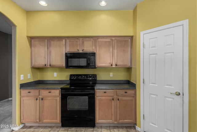 kitchen with arched walkways, dark countertops, recessed lighting, and black appliances