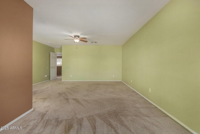16527 N 71st Dr, Peoria, AZ 85382 - spare room featuring ceiling fan, light colored carpet, baseboards, and visible vents