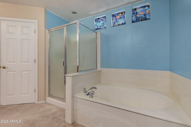 bathroom with a garden tub and a shower stall