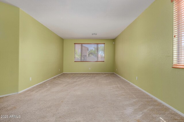16527 N 71st Dr, Peoria, AZ 85382 - carpeted spare room with baseboards and visible vents