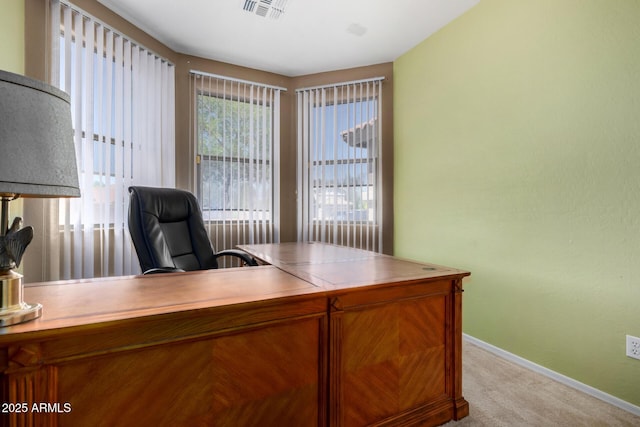 office with baseboards, light colored carpet, and visible vents