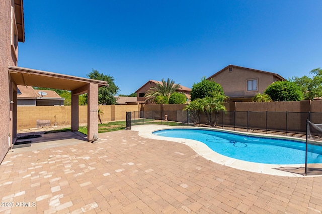 view of pool with a fenced backyard, a fenced in pool, and a patio area